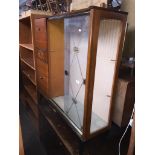 A retro sideboard/display cabinet with glazed doors on tapered legs Please note, lots 1-1000 are not