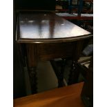A twist oak drop leaf table Please note, lots 1-1000 are not available for live bidding on the-