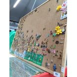 A pin board with pin badge collection. Please note, lots 1-1000 are not available for live bidding