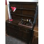 An Ercol Priory style dresser. Please note, lots 1-1000 are not available for live bidding on the-