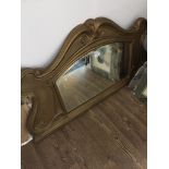 An Art Nouveau cast metal over mantle mirror, height 61cm, length 105cm. Please note, lots 1-1000