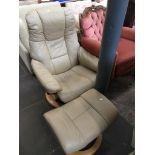 An Ekornes Stressless cream leather adjustable armchair and stool Please note, lots 1-1000 are not