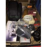 A box of cameras and accessories to include Sony Video camera, Kodak, etc Please note, lots 1-1000