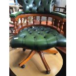 A reproduction buttoned green leather captains swivel chair Please note, lots 1-1000 are not