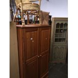 A pine wardrobe and a cane chair Please note, lots 1-1000 are not available for live bidding on