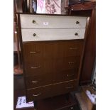 A retro mid 20th century chest of drawers together with an onyx and brass effect standard lamp