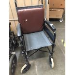 A folding wheelchair Please note, lots 1-1000 are not available for live bidding on the-saleroom.