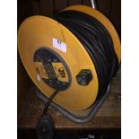 A cable extension reel. Please note, lots 1-1000 are not available for live bidding on the-
