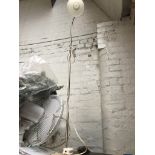 A tall standard lamp Please note, lots 1-1000 are not available for live bidding on the-saleroom.