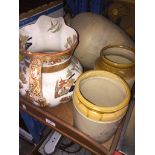 A wooden tray with a large jug, a pottery vase and two stonewarejars Please note, lots 1-1000 are