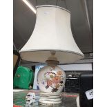 A pottery table lamp. Please note, lots 1-1000 are not available for live bidding on the-saleroom.
