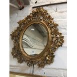 An ornate gilt wood framed mirror, total length approx 60cm width 52cm. Please note, lots 1-1000 are