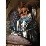 A box of misc to include DVDs, door stopper, ornaments, etc Please note, lots 1-1000 are not