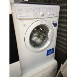 An Indesit washing machine Please note, lots 1-1000 are not available for live bidding on the-