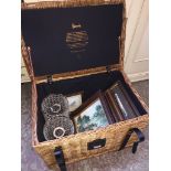 A Harrods wicker basket and contents (pictures and lamp shades) Please note, lots 1-1000 are not