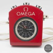 AN OMEGA SPLIT SECONDS CHRONOGRAPH TIMER IN ORIGINAL FITTED PLASTIC CASE WITH SHOULDER STRAP CIRCA