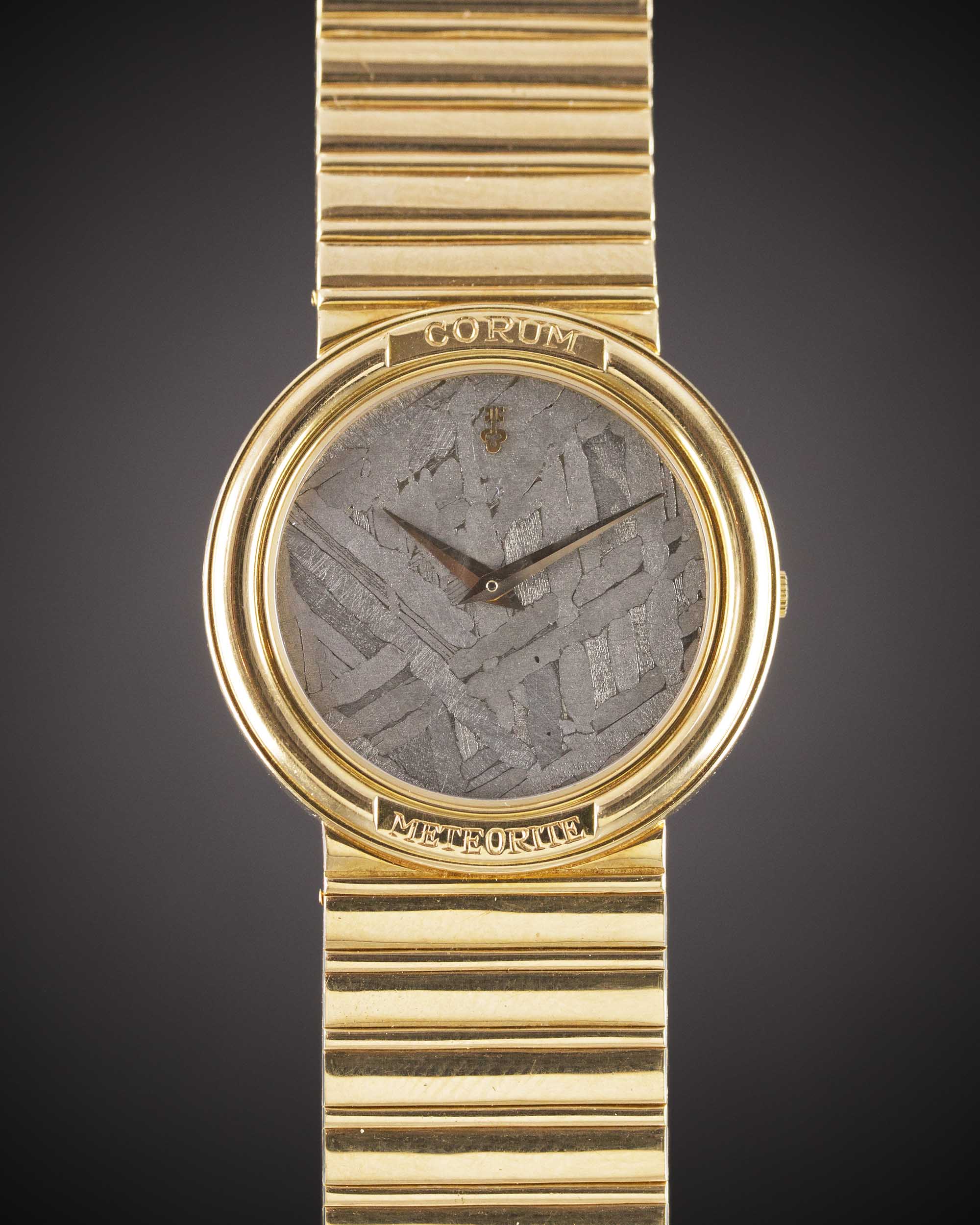 A GENTLEMAN'S SIZE 18K SOLID YELLOW GOLD CORUM METEORITE BRACELET WATCH CIRCA 1990s, REF. 50451-