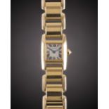 A LADIES 18K SOLID GOLD CARTIER TANKISSIME BRACELET WATCH DATED 2005, REF. W650018H / 2829 WITH