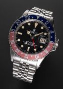 A GENTLEMAN'S STAINLESS STEEL ROLEX OYSTER PERPETUAL GMT MASTER "PEPSI" BRACELET WATCH CIRCA 1973,