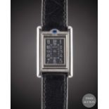A LADIES STAINLESS STEEL CARTIER TANK BASCULANTE WRIST WATCH CIRCA 2000, REF. 2386 WITH SPECIAL