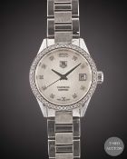A LADIES STAINLESS STEEL & DIAMOND TAG HEUER CARRERA CALIBRE 9 AUTOMATIC BRACELET WATCH CIRCA