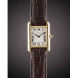 A LADIES 18K SOLID GOLD CARTIER PARIS TANK MECANIQUE WRIST WATCH CIRCA 1980s Movement: 17J, manual