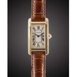 A LADIES 18K YELLOW GOLD GOLD CARTIER TANK AMERICAINE WRIST WATCH CIRCA 2005, REF. 2482 Movement: