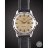 A GENTLEMAN'S STAINLESS STEEL LONGINES CONQUEST CALENDAR AUTOMATIC WRIST WATCH CIRCA 1957, REF. 9004