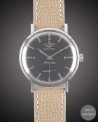 A GENTLEMAN'S STAINLESS STEEL LONGINES GRAND PRIZE AUTOMATIC WRIST WATCH CIRCA 1960, WITH GLOSS