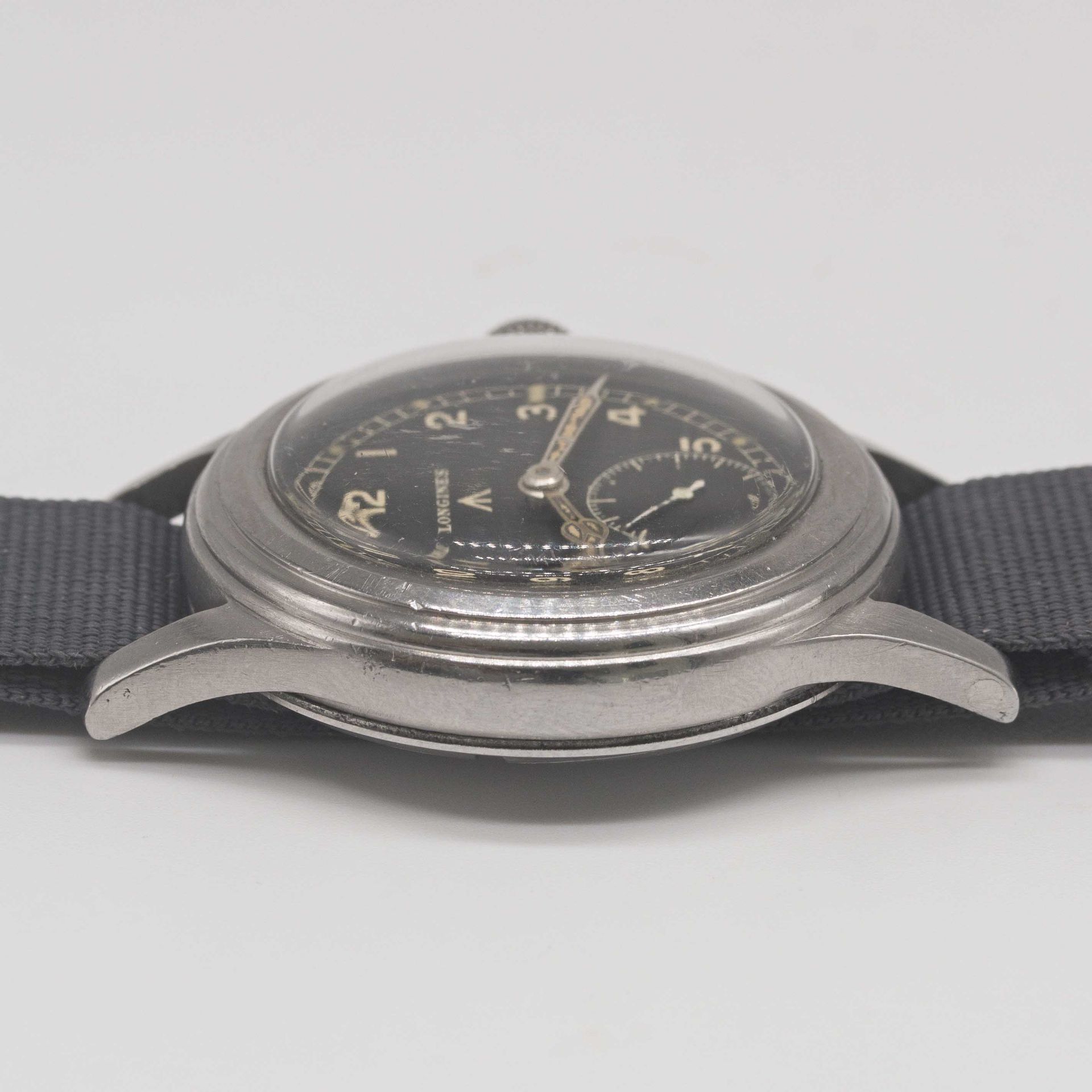 A GENTLEMAN'S STAINLESS STEEL BRITISH MILITARY LONGINES W.W.W. WRIST WATCH CIRCA 1945, PART OF - Image 8 of 9