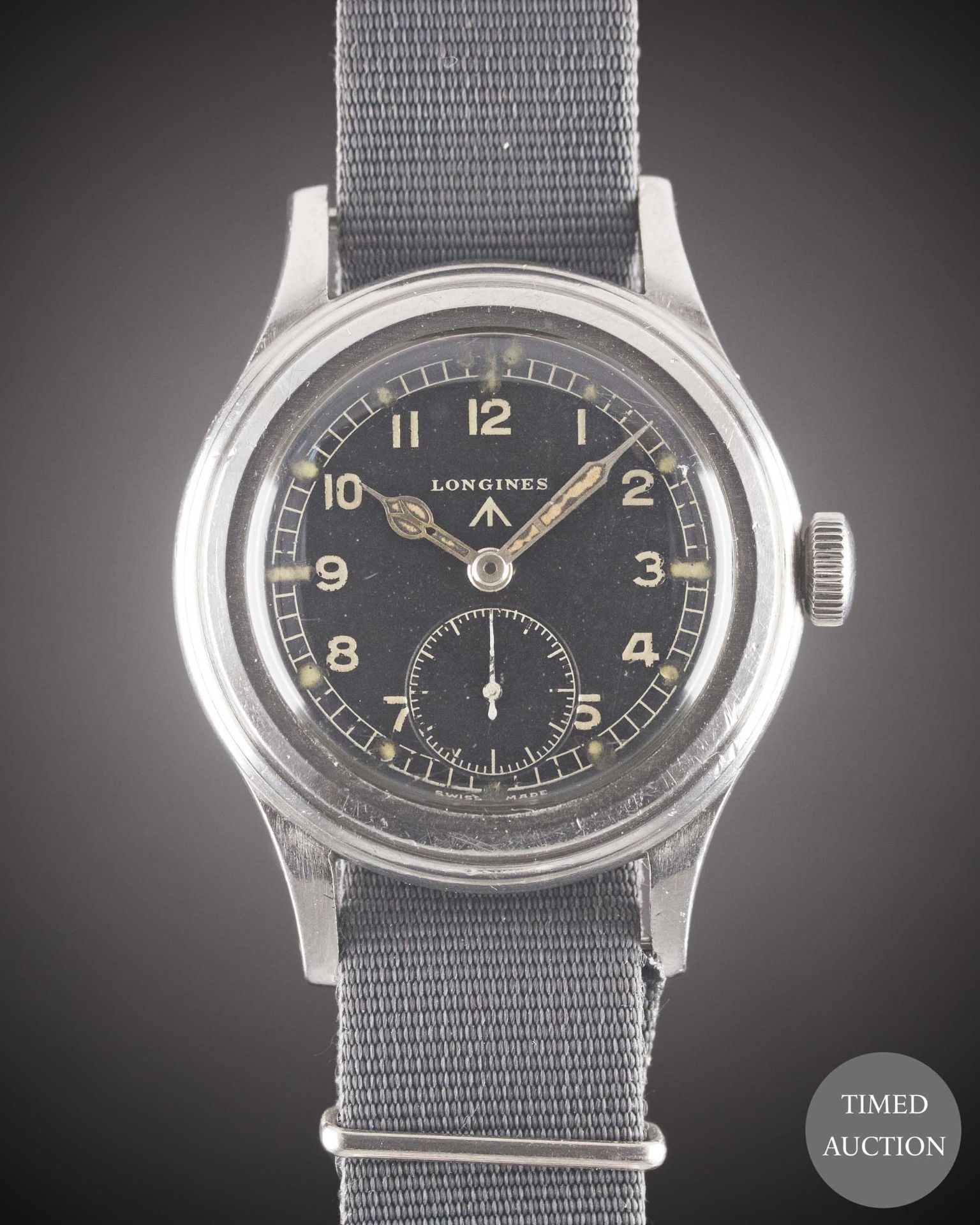 A GENTLEMAN'S STAINLESS STEEL BRITISH MILITARY LONGINES W.W.W. WRIST WATCH CIRCA 1945, PART OF