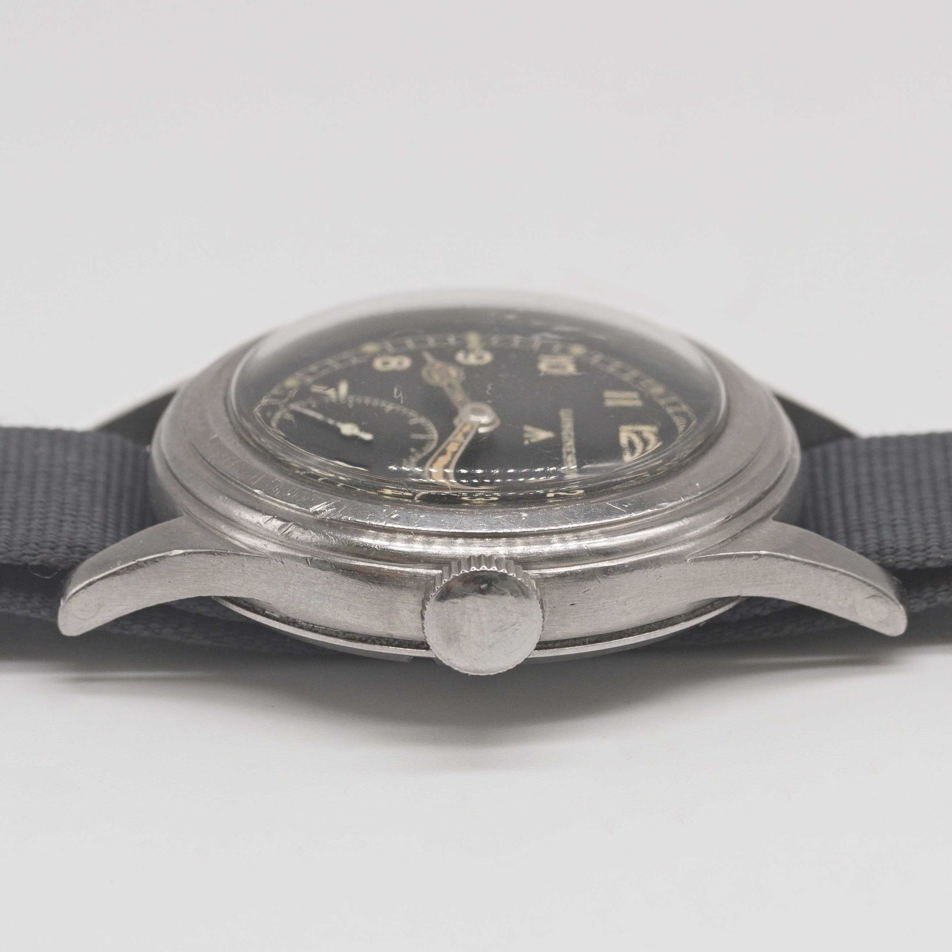 A GENTLEMAN'S STAINLESS STEEL BRITISH MILITARY LONGINES W.W.W. WRIST WATCH CIRCA 1945, PART OF - Image 7 of 9