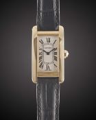 A LADIES 18K SOLID YELLOW GOLD CARTIER TANK AMERICAINE WRIST WATCH DATED 2005, REF. 2482 WITH