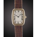 A GENTLEMAN'S SIZE 18K SOLID GOLD CARTIER FABERGE TONNEAU WRIST WATCH CIRCA 1980s Movement: 17J,