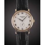 A GENTLEMAN'S 18K SOLID ROSE GOLD PATEK PHILIPPE CALATRAVA WRIST WATCH CIRCA 1990s, REF. 5022 WITH