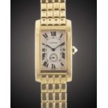 A GENTLEMAN'S SIZE 18K SOLID YELLOW GOLD CARTIER TANK AMERICAINE BRACELET WATCH CIRCA 1990s, REF.