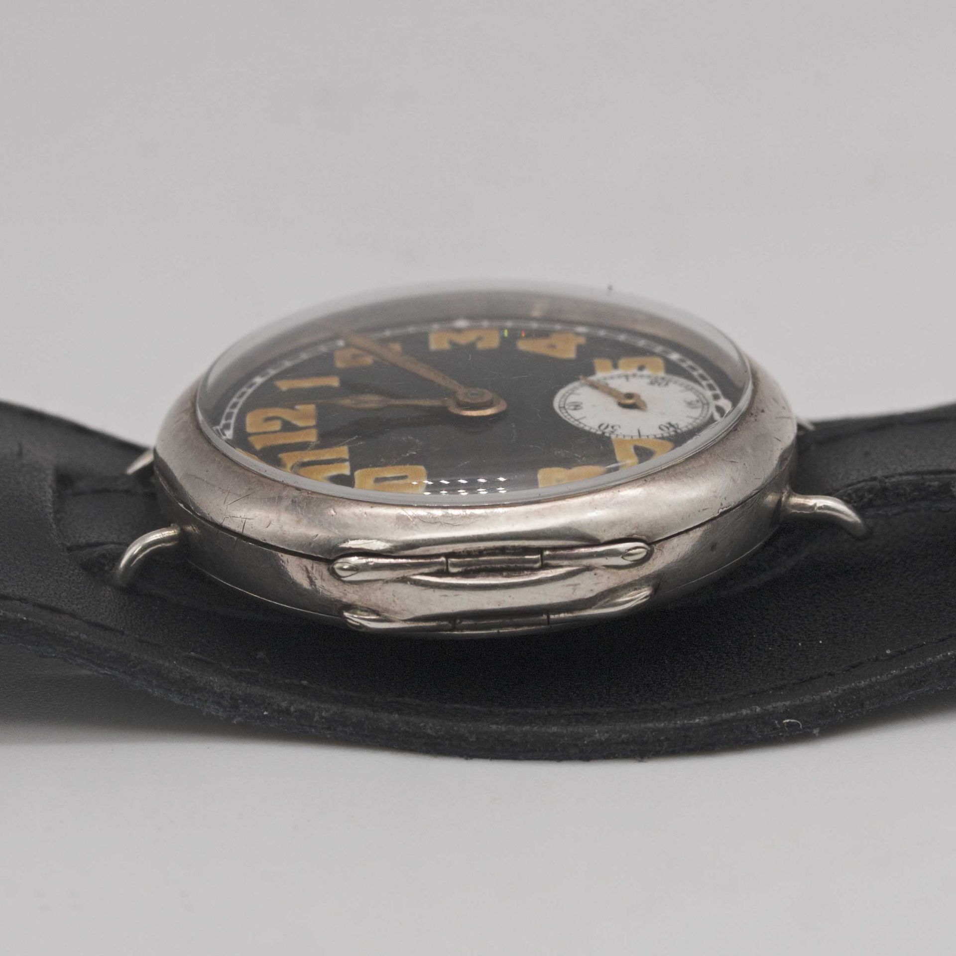 A GENTLEMAN'S SOLID SILVER ROLEX OFFICERS WRIST WATCH CIRCA 1918, WITH BLACK ENAMEL DIAL & CATHEDRAL - Image 10 of 10