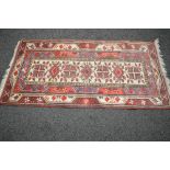 Cream ground rug having purple and red pattern with end tassels - 38" x 75"