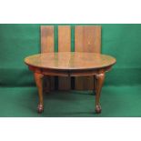 Oak oval wind out extending dining table the top having moulded edge,