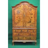 Burr walnut Queen Anne style linen cupboard having two panelled doors opening to reveal three fixed