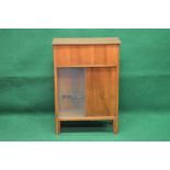 Mid century walnut drinks cabinet the sides having glass panels and carrying handles,
