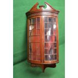 Mahogany wall hanging corner cupboard having blind fretwork decoration over two bow fronted glazed