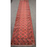 Red ground carpet runner having white and black pattern - 33" x 154"