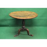 19th century oak tip top occasional table having circular top supported on a bulbous turned column