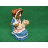 Battery powered tinplate and plastic automaton of a mother bear feeding baby bear milk from a