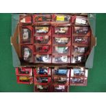 Twenty Eight 1980's Matchbox Models Of Yesteryear commercial vehicles contained in maroon window