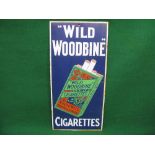 Enamel advertising sign for Wild Woodbine Cigarettes featuring a detailed illustration of a packet