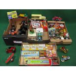 Four boxes of mostly tin or tin and plastic toys and games from various manufacturers in Britain,