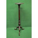 Mahogany torchere having circular top with moulded edge supported on a reeded and carved column