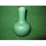 Oriental green glazed crackle ware vase having narrow tapering neck leading to a bulbous body,